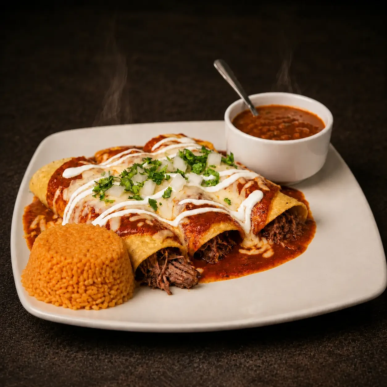 Brisket enchiladas under chocolate chipotle sauce with melted cheese, crema, Mexican rice and a cup of borracho beans at Iron Cactus